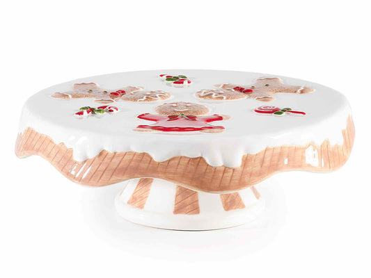Alzatina natalizia in ceramica vista di lato, con il bordo a effetto glassa che cola e i biscotti di pan di zenzero in rilievo sul piano