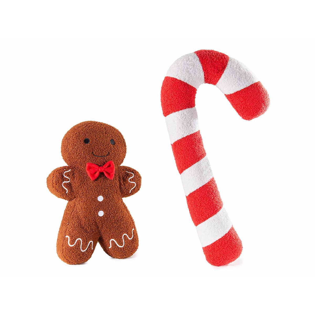 Coppia di cuscini di Natale in pile: omino di pan di zenzero con papillon rosso e bastoncino di zucchero rosso e bianco, su fondo bianco